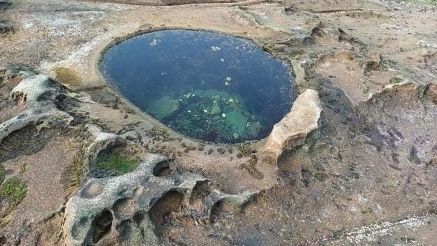 limestone hole with water